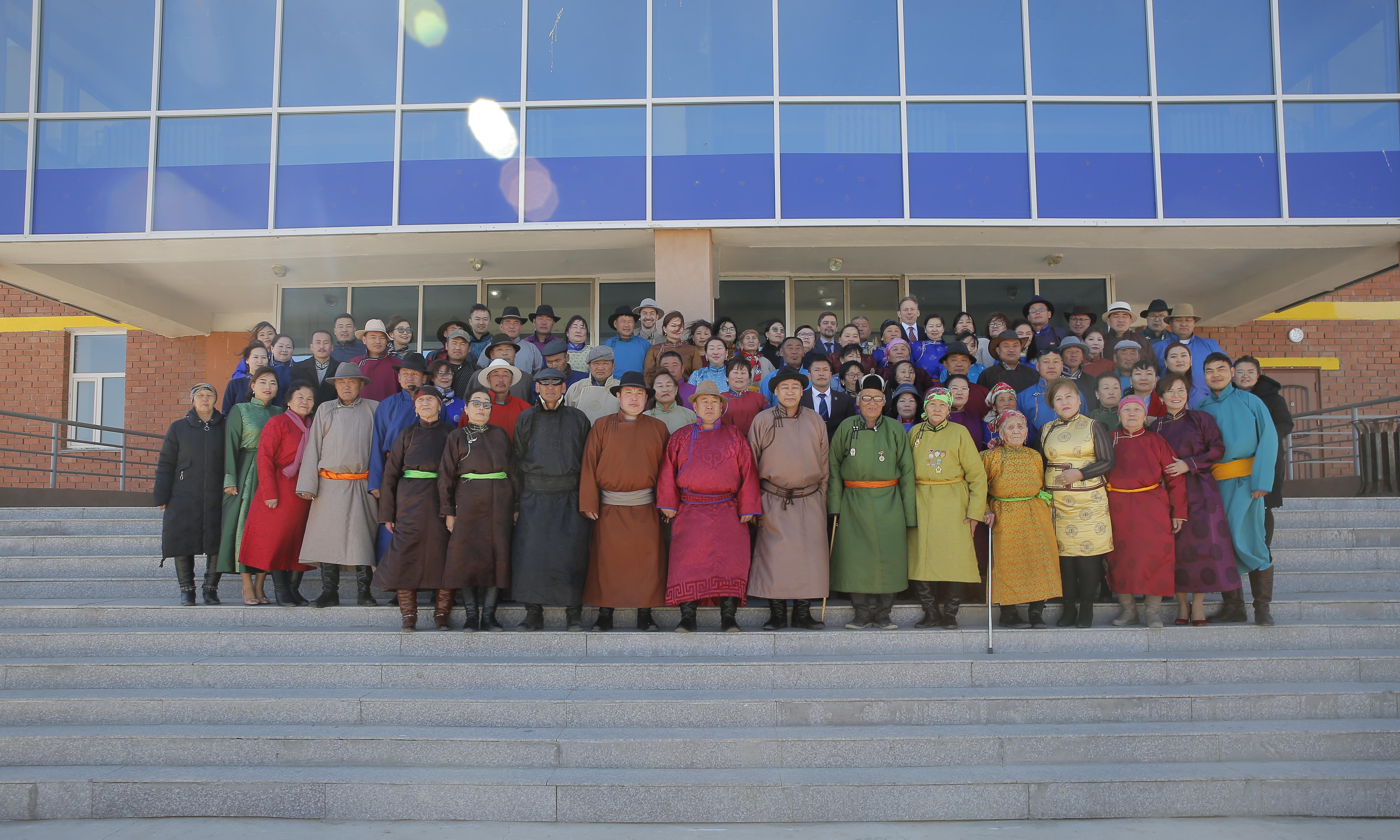 People Stand in front of a building